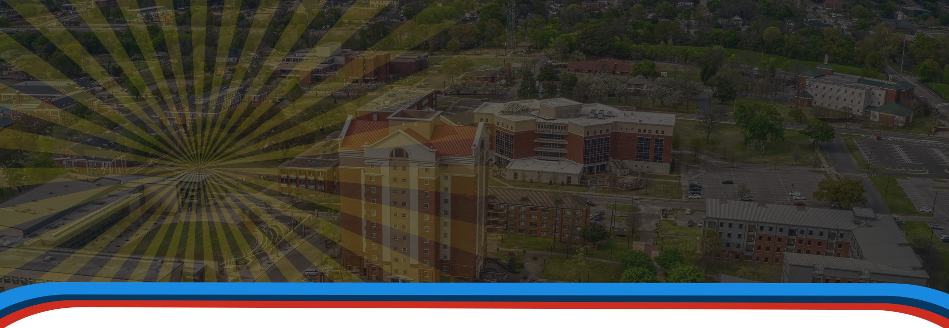 Decorative banner with a ferris wheel and campus buildings under a dark overlay